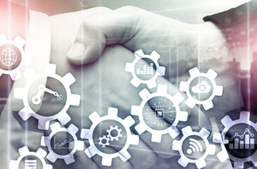 Im Hintergrund sieht man wie sich zwei Hände schütteln. Im Vordergrund sind Zahnräder mit Icons wie Roboterarm, Globus, Cloud, Datennetz, Diagramm abgebildet als Symbol für Wertschöpfungsnetzwerke.